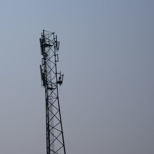 A tall tower with a cell phone on top of it, illustrating jamming in a Tijuana prison