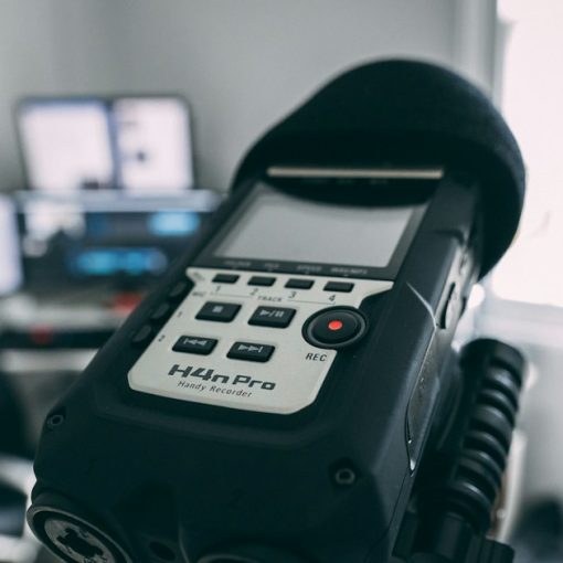 Digital audio recorder on a stand, illustrating evidence from recorded jail calls