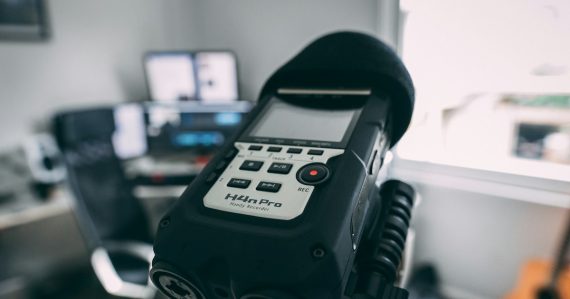 Digital audio recorder on a stand, illustrating evidence from recorded jail calls