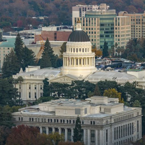 California state capitol building and surrounding cityscape, illustrating California targeting prison phone use