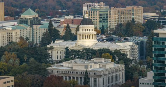 California state capitol building and surrounding cityscape, illustrating California targeting prison phone use