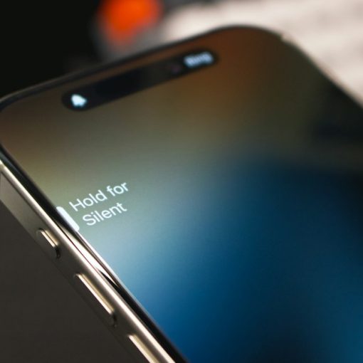 A close up of a cell phone with a keyboard in the background, illustrating phones in Ohio prisons
