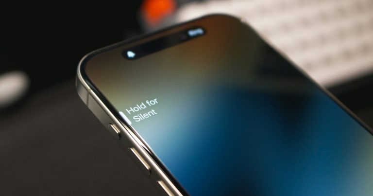 A close up of a cell phone with a keyboard in the background, illustrating phones in Ohio prisons