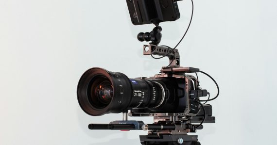 Black dslr camera on white table, illustrating National Geographic's Cellphone War