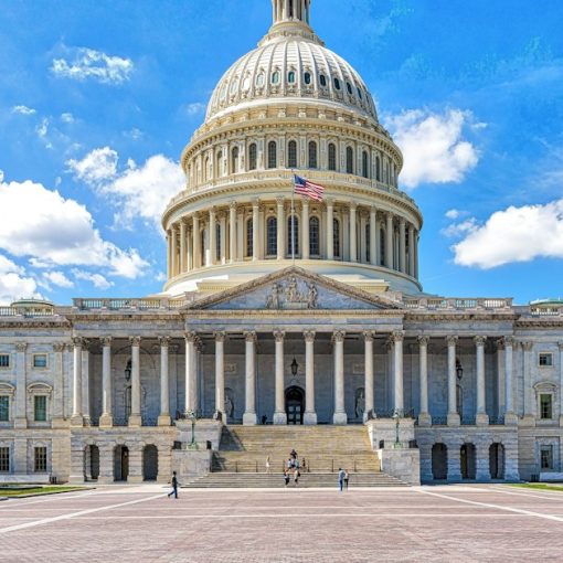 A large building with a dome and a flag on top, illustrating Idaho contraband phone legislation