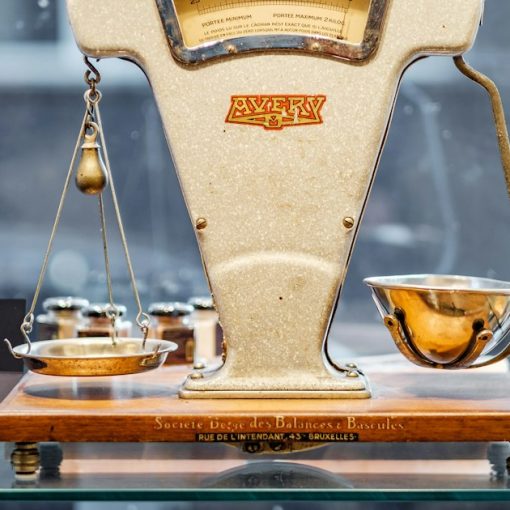 Brown and beige weighing scale, illustrating supply and demand for contraband cell phones