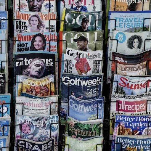 A pile of newspapers stacked on top of each other, illustrating recent contraband phone news