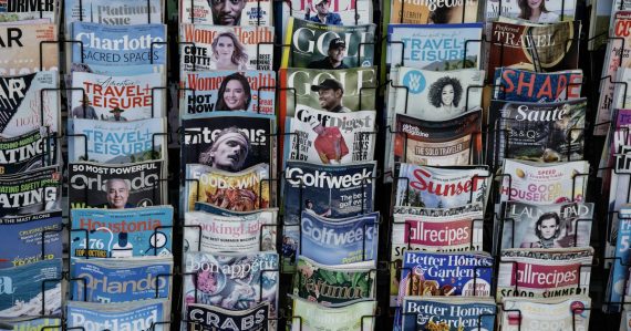 A pile of newspapers stacked on top of each other, illustrating recent contraband phone news