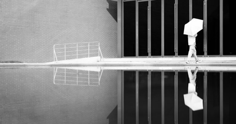 A black and white photo of a jail cell, illustrating guards drawn into contraband smuggling