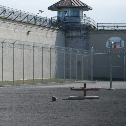 Prison backyard, illustrating a guard arrested for delivering a phone