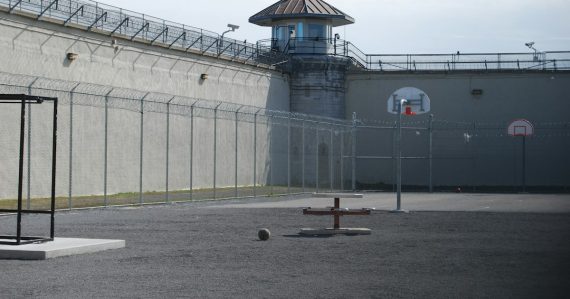 Prison backyard, illustrating a guard arrested for delivering a phone