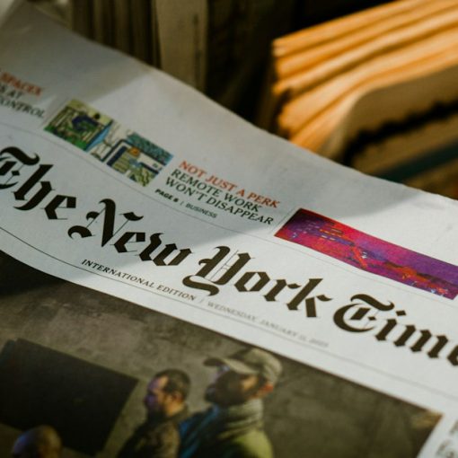 A person reading a newspaper, illustrating an LA Times call to cut off phones