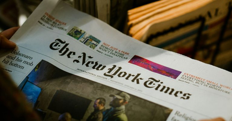 A person reading a newspaper, illustrating an LA Times call to cut off phones