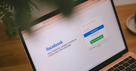 A laptop displays the facebook login page, illustrating a killer using Facebook despite jamming