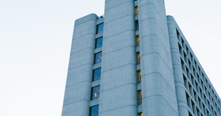 Man's eyeview of multi-storey building, illustrating an FBI sting smuggling a phone