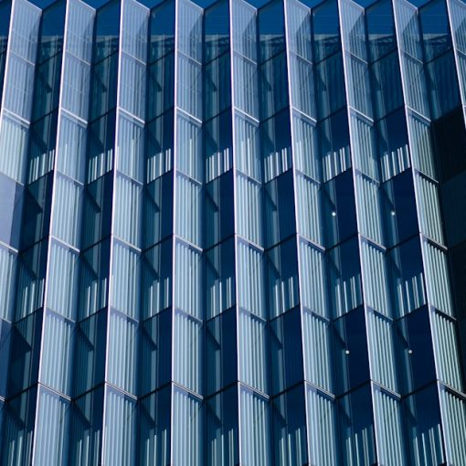 Blue and white concrete building, illustrating rising phone use in federal prisons