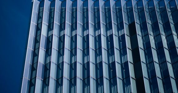 Blue and white concrete building, illustrating rising phone use in federal prisons