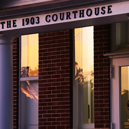 A 1903 courthouse at sunset, illustrating a court stay on FCC inmate call rates