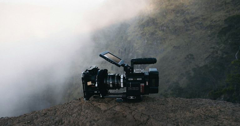 Black video camera on rock, illustrating a video on the growing phone problem