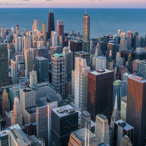 White and brown city buildings during daytime, illustrating Illinois efforts against contraband phones