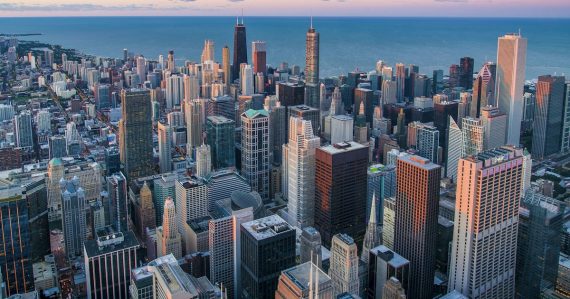 White and brown city buildings during daytime, illustrating Illinois efforts against contraband phones