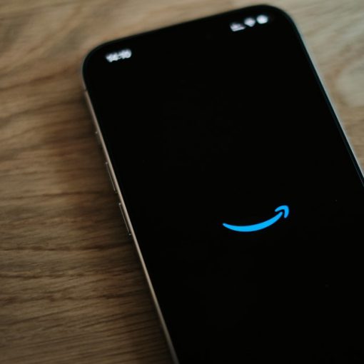 A black cell phone with a blue smiley face on it, illustrating the value of inbound calls to prisoners