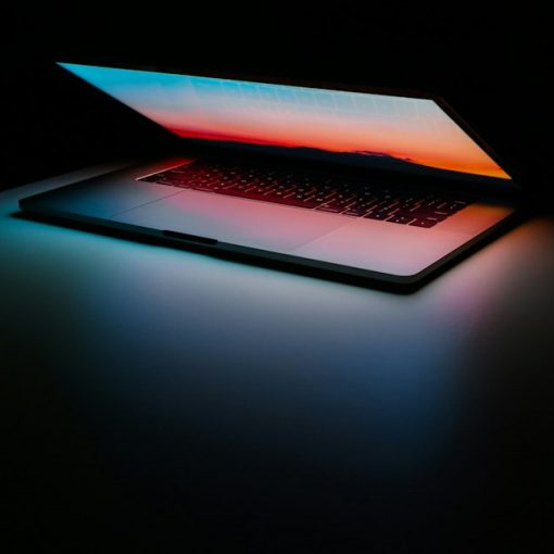 Gray and black laptop computer on surface, illustrating inmates surfing the web from prison