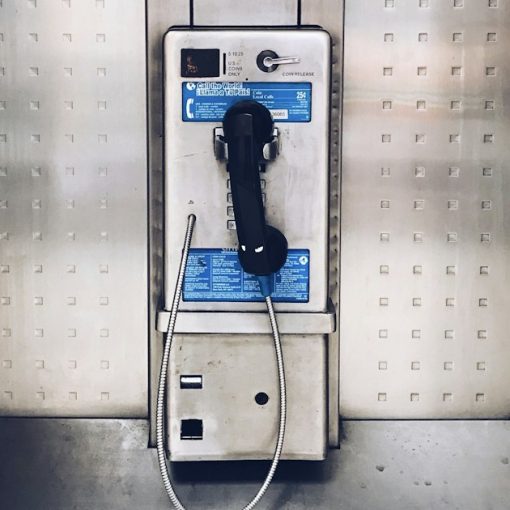 Gray payphone close up photography, illustrating a look inside prison life