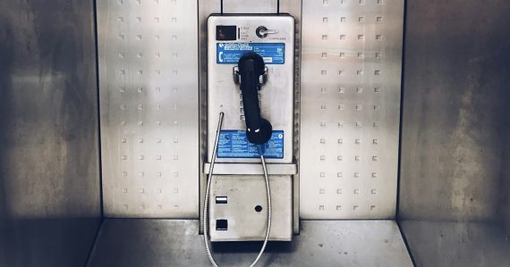 Gray payphone close up photography, illustrating a look inside prison life
