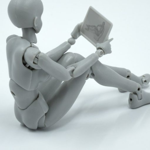 A person sitting on the ground with a laptop, illustrating a jailed terrorist denied Skype