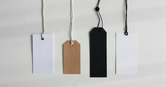 Four paper card tags, illustrating costly systems to keep phones out