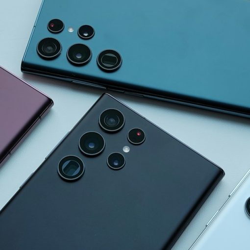 A group of four different colored cell phones, illustrating Israel seizing phones at a prison