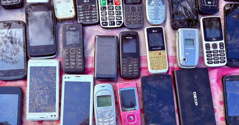 A collection of various old mobile phones and devices, illustrating mobile phones found in Liverpool prisons