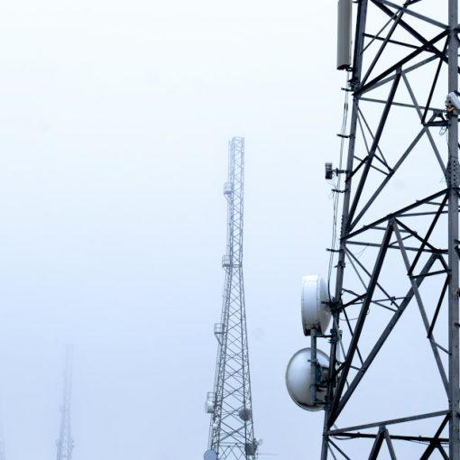 A tower with several cell phones on top of it, illustrating Maryland's grant for managed access
