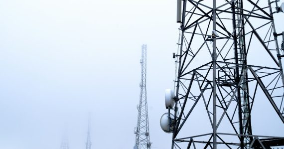 A tower with several cell phones on top of it, illustrating Maryland's grant for managed access