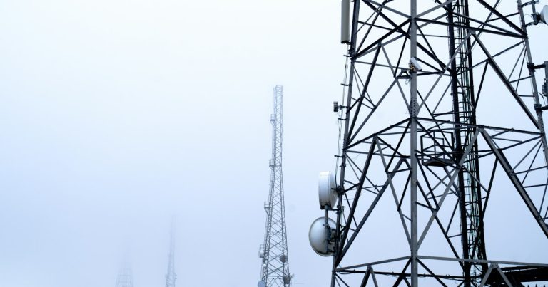 A tower with several cell phones on top of it, illustrating Maryland's grant for managed access