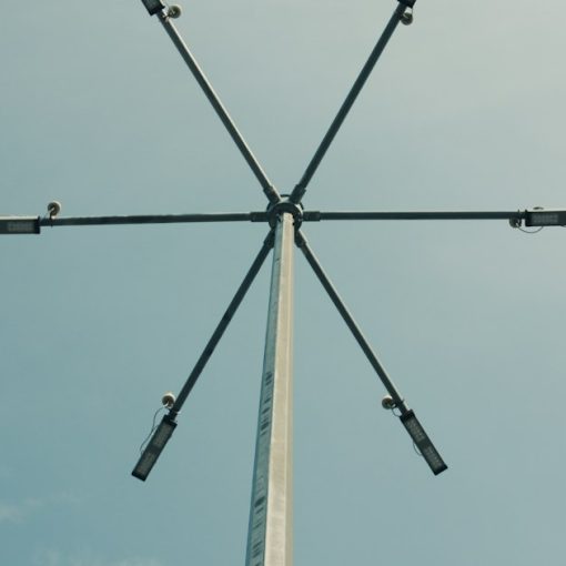 A tall pole with four antennas on top of it, illustrating the federal micro-jamming test