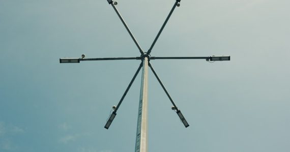 A tall pole with four antennas on top of it, illustrating the federal micro-jamming test
