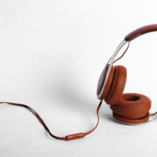 Red and gray corded headphones, illustrating MP3s, video visitation and voice mail in prisons
