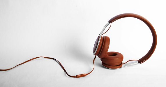 Red and gray corded headphones, illustrating MP3s, video visitation and voice mail in prisons