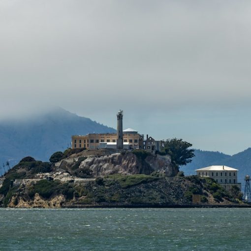 Alcatraz island prison under a cloudy sky, illustrating California's out of control phone smuggling