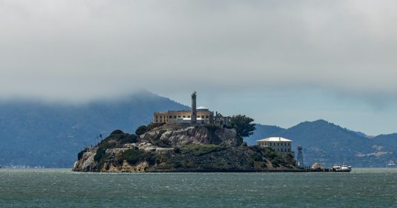 Alcatraz island prison under a cloudy sky, illustrating California's out of control phone smuggling