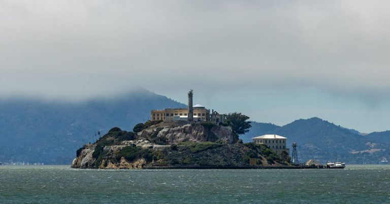 Alcatraz island prison under a cloudy sky, illustrating California's out of control phone smuggling