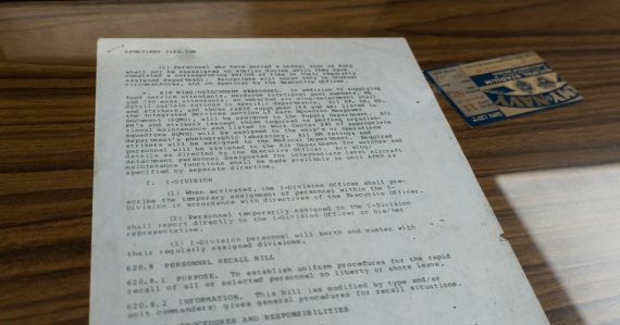 Old document with text and small card, illustrating Securus patent lawsuits