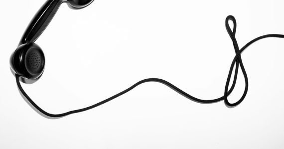 Black corded telephone, illustrating allowing phones in prison cells