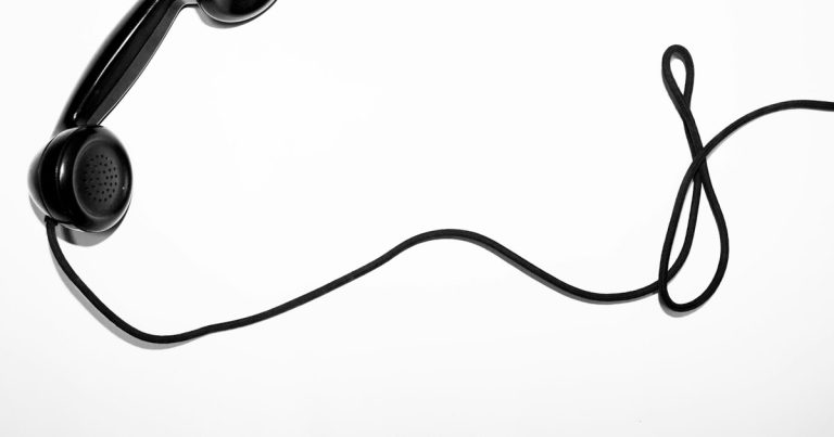 Black corded telephone, illustrating allowing phones in prison cells