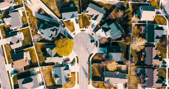 An aerial view of a neighborhood with lots of houses, illustrating jamming blocking neighbors' service