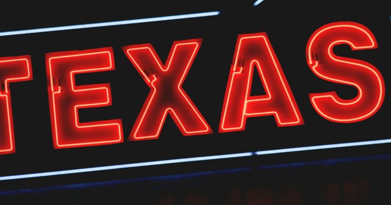Red Texas neon light sign, illustrating phones and prisoner rehabilitation