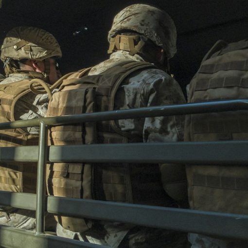 Soldiers in truck, illustrating donating confiscated phones to soldiers