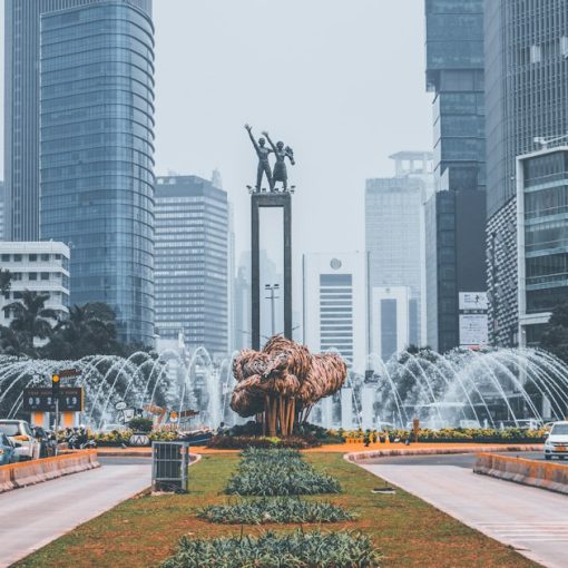 The Selamat Datang Monument surrounded by skyscrapers in Jakarta, illustrating jammers in a Jakarta prison